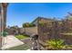 Private backyard with a barbecue grill, artificial turf, and well-maintained landscaping at 19930 N 98Th Ave, Peoria, AZ 85382