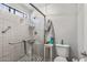 Modern bathroom featuring a walk-in shower with stylish tiling and a handheld shower at 19930 N 98Th Ave, Peoria, AZ 85382