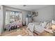 Bright bedroom with a functional workstation, natural lighting, and minimalist decor at 19930 N 98Th Ave, Peoria, AZ 85382