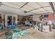Cluttered garage, filled with storage and household items at 19930 N 98Th Ave, Peoria, AZ 85382