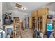 Garage with utility storage, water heater, and storage shelves at 19930 N 98Th Ave, Peoria, AZ 85382