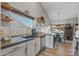 Bright and airy kitchen with stainless steel appliances, bright cabinets, and natural light at 19930 N 98Th Ave, Peoria, AZ 85382