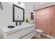 Chic bathroom featuring a modern vanity, sleek fixtures, and stylish shower curtain at 2033 E Janice Way, Phoenix, AZ 85022