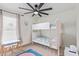 bedroom with a bunk bed, a colorful rug, and a playful atmosphere, ideal for children at 2033 E Janice Way, Phoenix, AZ 85022