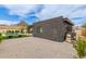 This home's exterior has desert landscaping, a backyard pool, and mountain views in the background at 2033 E Janice Way, Phoenix, AZ 85022