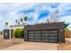 Charming single-story home featuring unique architectural details and desert landscaping, a modern garage door and drought tolerant plantings at 2033 E Janice Way, Phoenix, AZ 85022