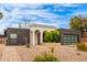 Charming single-story home featuring unique architectural details and desert landscaping, a modern garage door and drought tolerant plantings at 2033 E Janice Way, Phoenix, AZ 85022