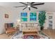 Bright and airy living room with modern decor and large windows at 2033 E Janice Way, Phoenix, AZ 85022