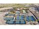 Community aerial view featuring tennis and pickleball courts, swimming pools, clubhouse, and parking areas at 20797 W Rattler Rd, Buckeye, AZ 85396