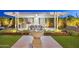 Charming backyard with a pergola, outdoor kitchen, stylish dining area, and a tranquil fountain feature at 20797 W Rattler Rd, Buckeye, AZ 85396