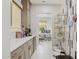 Butlery featuring quartz countertops, light colored cabinets, and tile floors at 20797 W Rattler Rd, Buckeye, AZ 85396