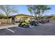 Several golf carts parked in a row at the parking lot at 20797 W Rattler Rd, Buckeye, AZ 85396