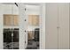 Convenient laundry room featuring modern appliances, tiled flooring, and ample cabinetry at 20797 W Rattler Rd, Buckeye, AZ 85396