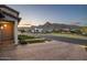 Attractive neighborhood street scene with mountain views and well-maintained landscaping at 20797 W Rattler Rd, Buckeye, AZ 85396