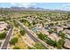 Expansive aerial view of the community showcasing desert landscaping, pools, and stunning mountain views at 21240 N 74Th Pl, Scottsdale, AZ 85255