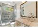 Modern bathroom with a glass enclosed shower, vanity, and stylish fixtures at 21240 N 74Th Pl, Scottsdale, AZ 85255