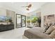 Bright bedroom features large glass door view to pool and patio area at 21240 N 74Th Pl, Scottsdale, AZ 85255