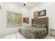Bedroom with a large bed, shuttered windows, and ample natural light at 21240 N 74Th Pl, Scottsdale, AZ 85255