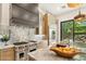 This is a kitchen featuring stainless steel appliances and marble countertops with an open concept design at 21240 N 74Th Pl, Scottsdale, AZ 85255