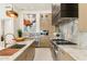 Gourmet kitchen featuring marble countertops and backsplash, stainless steel appliances, and custom cabinetry at 21240 N 74Th Pl, Scottsdale, AZ 85255