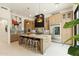 Modern, eat-in kitchen with stainless steel appliances, marble countertops, and light wood cabinetry at 21240 N 74Th Pl, Scottsdale, AZ 85255