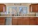 Kitchen with granite counters, modern stainless steel dishwasher, a large sink, and lots of cabinet space at 2150 W Alameda Rd # 1313, Phoenix, AZ 85085