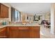 Open kitchen overlooking living area, featuring granite countertops and a breakfast bar seating area at 2150 W Alameda Rd # 1313, Phoenix, AZ 85085