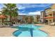 Resort-style community pool with lounge seating and palm trees, perfect for relaxation and enjoyment at 2150 W Alameda Rd # 1313, Phoenix, AZ 85085