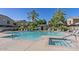 Inviting pool and spa area with ample seating, lush landscaping, and shade structures for a resort-like experience at 2150 W Alameda Rd # 1313, Phoenix, AZ 85085