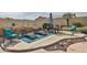 Inviting backyard oasis featuring a patio with lounge chairs and desert-inspired landscaping at 21968 W Hadley St, Buckeye, AZ 85326