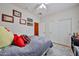 Cozy bedroom with neutral walls, a gray bedspread, and a closet with white sliding doors at 21968 W Hadley St, Buckeye, AZ 85326