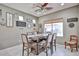 Charming dining area with a wooden table, upholstered chairs, and decorative wall art at 21968 W Hadley St, Buckeye, AZ 85326