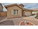 Charming home exterior showcasing desert landscaping, a two-car garage, and appealing architectural details at 21968 W Hadley St, Buckeye, AZ 85326