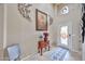 Welcoming foyer featuring decorative accents, a patterned rug, and a stylish front door with stained glass at 21968 W Hadley St, Buckeye, AZ 85326