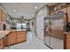 Bright kitchen featuring tile floors, stainless steel appliances, and granite countertops at 21968 W Hadley St, Buckeye, AZ 85326