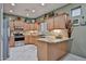 Updated kitchen with stainless steel appliances, granite countertops, and ample cabinet space at 21968 W Hadley St, Buckeye, AZ 85326