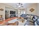 Inviting living room showcasing hardwood floors, a ceiling fan, and ample seating for relaxation at 21968 W Hadley St, Buckeye, AZ 85326