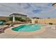 Beautiful backyard pool with surrounding desert landscaping, ideal for outdoor relaxation and entertainment at 21968 W Hadley St, Buckeye, AZ 85326