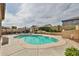 Serene backyard pool surrounded by mature landscaping and comfortable seating, perfect for summer days at 21968 W Hadley St, Buckeye, AZ 85326