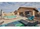Enjoy this home's backyard pool, patio, and screened in porch that are perfect for outdoor living at 21968 W Hadley St, Buckeye, AZ 85326