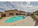 Inviting backyard pool with lounge area perfect for relaxing and entertaining, featuring ample space at 21968 W Hadley St, Buckeye, AZ 85326