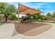Community playground shaded with mature trees at 2438 W Via Dona Rd, Phoenix, AZ 85085