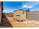 Backyard shed with a small window at 2551 E Harmony Ave, Mesa, AZ 85204