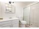 White bathroom featuring a shower, a toilet, and a vanity at 2551 E Harmony Ave, Mesa, AZ 85204