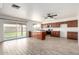 Open kitchen area featuring wood cabinets, marble countertops, and stainless steel appliances at 2551 E Harmony Ave, Mesa, AZ 85204