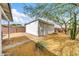 A backyard with a detached structure, some desert landscaping, and brick accents at 2801 N 10Th St, Phoenix, AZ 85006