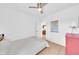 This bright bedroom has a ceiling fan, light wood floors, and ample natural light at 2801 N 10Th St, Phoenix, AZ 85006