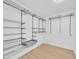 Walk-in closet featuring built in shelving and laminate flooring at 2801 N 10Th St, Phoenix, AZ 85006