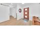 Open foyer features sleek flooring, a vibrant front door, and a barn door leading to other living spaces at 2801 N 10Th St, Phoenix, AZ 85006