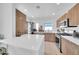 Modern kitchen with an island, stainless steel appliances, sleek cabinetry, and a convenient laundry area at 2801 N 10Th St, Phoenix, AZ 85006